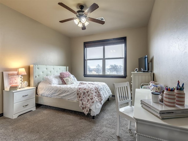 bedroom featuring ceiling fan and carpet