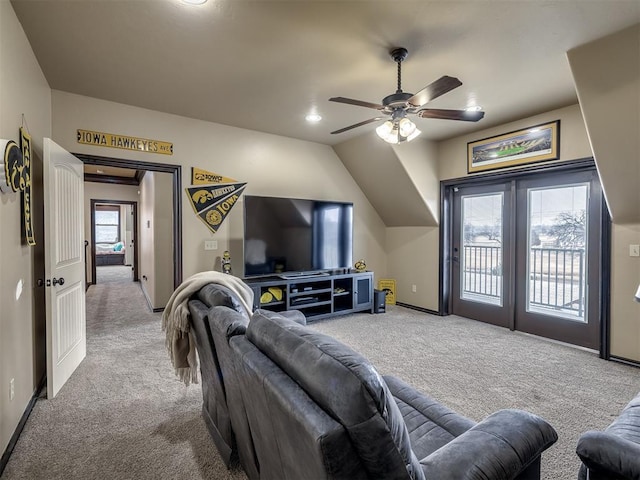 living room featuring carpet, lofted ceiling, and ceiling fan