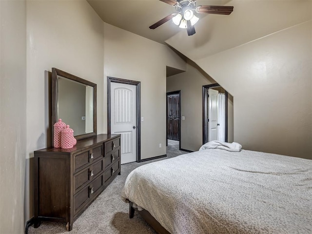 bedroom featuring ceiling fan, carpet flooring, and vaulted ceiling