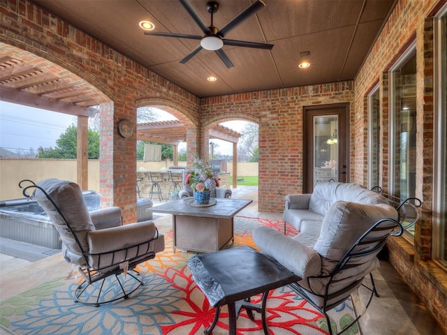 view of patio / terrace with ceiling fan and an outdoor living space