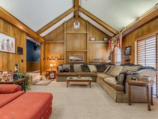 carpeted living room with wooden walls, lofted ceiling with beams, and a textured ceiling