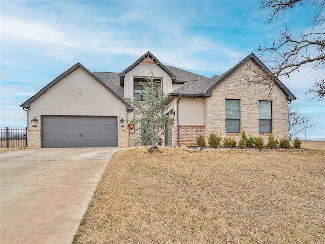 view of front of home featuring a garage and a front yard