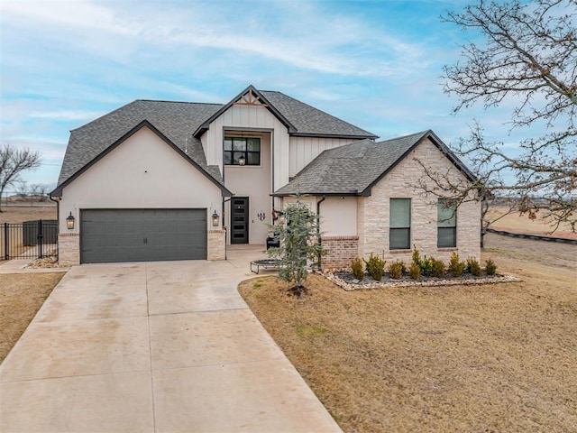 view of front of home with a garage and a front lawn