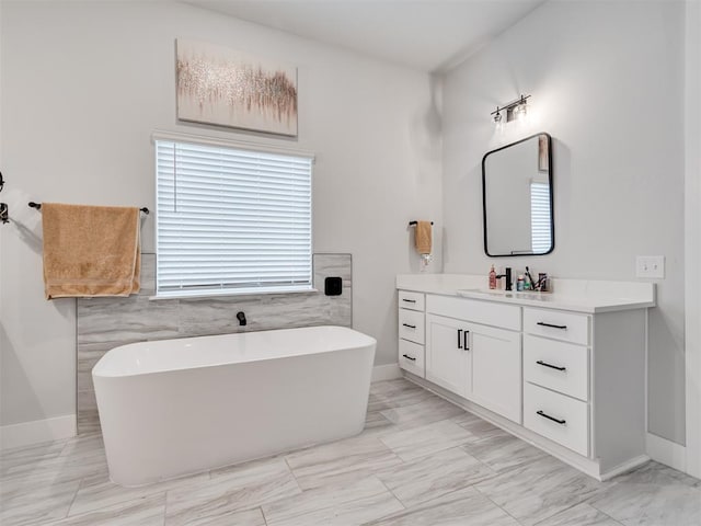 bathroom featuring vanity and a tub to relax in