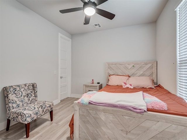 bedroom with ceiling fan and light wood-type flooring