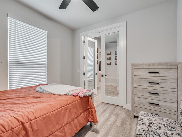 bedroom featuring french doors, ceiling fan, and light hardwood / wood-style floors