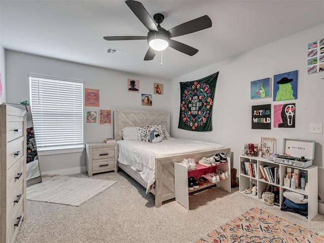 bedroom featuring light colored carpet and ceiling fan