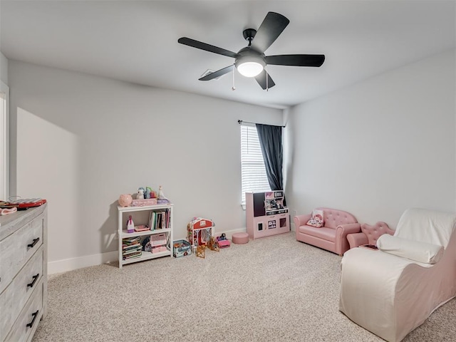 recreation room featuring ceiling fan and carpet flooring