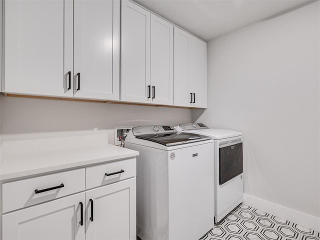 laundry area featuring cabinets and independent washer and dryer