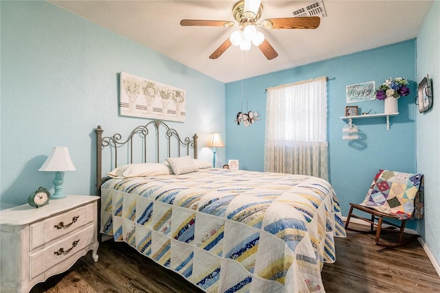 bedroom featuring dark hardwood / wood-style floors and ceiling fan