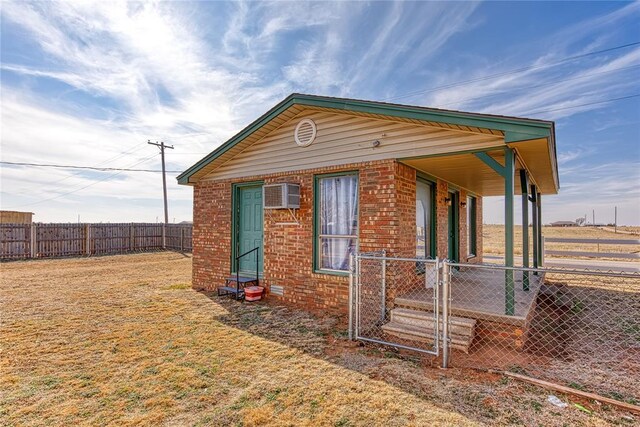 view of property exterior featuring an AC wall unit