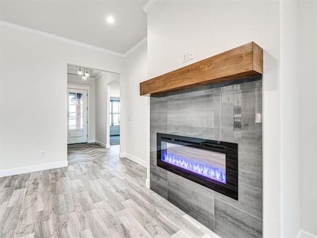 interior details featuring crown molding, a fireplace, and wood-type flooring