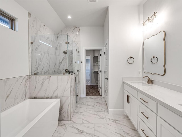 bathroom with independent shower and bath and vanity