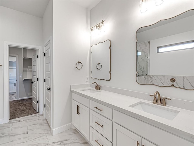 bathroom featuring walk in shower and vanity