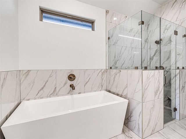 bathroom featuring tile walls and plus walk in shower