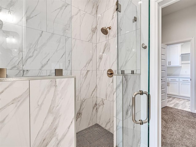 bathroom featuring an enclosed shower