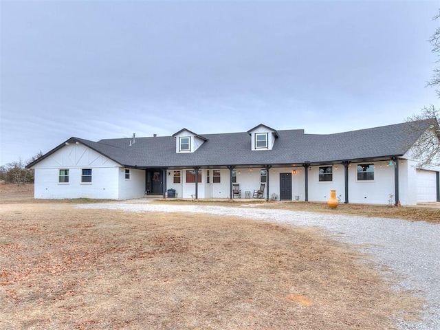 view of front of home featuring roof with shingles