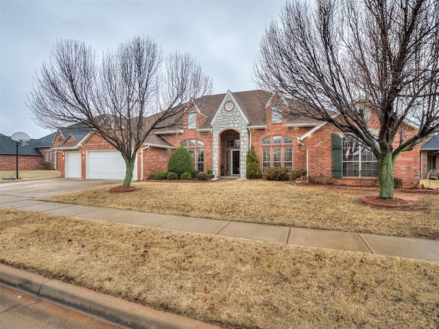 view of front of property with a garage and a front yard