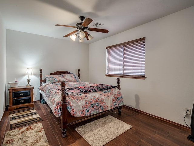 bedroom featuring ceiling fan and dark hardwood / wood-style floors