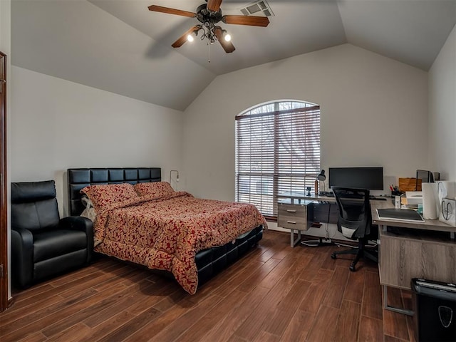 bedroom with ceiling fan, dark hardwood / wood-style floors, and vaulted ceiling