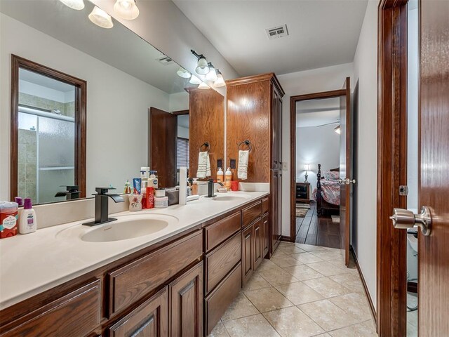 bathroom featuring tile patterned floors and vanity