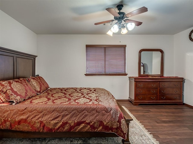 bedroom featuring ceiling fan and dark hardwood / wood-style flooring