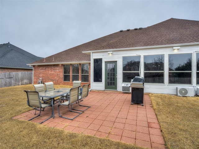 view of patio / terrace with a grill and ac unit