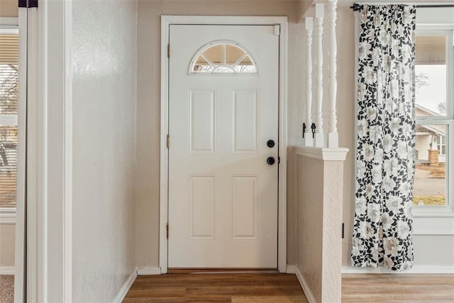 doorway to outside with hardwood / wood-style floors