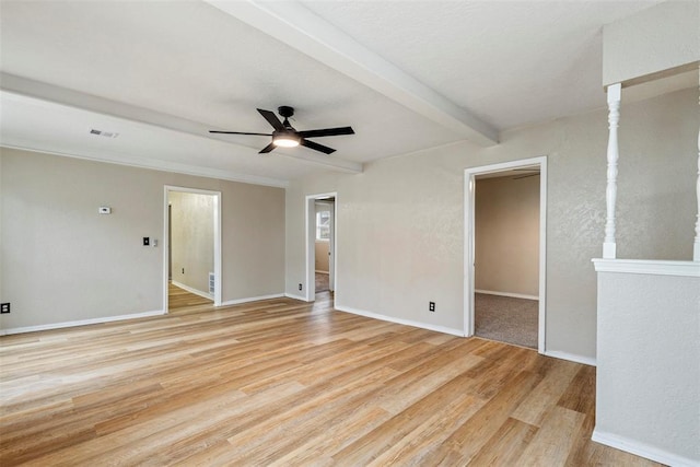 spare room featuring beamed ceiling, ceiling fan, and light hardwood / wood-style flooring