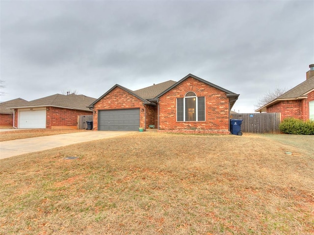 single story home featuring a garage and a front lawn