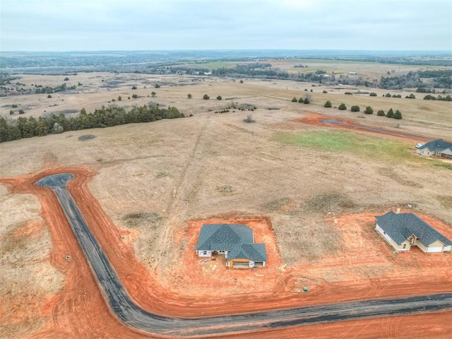 birds eye view of property featuring a rural view