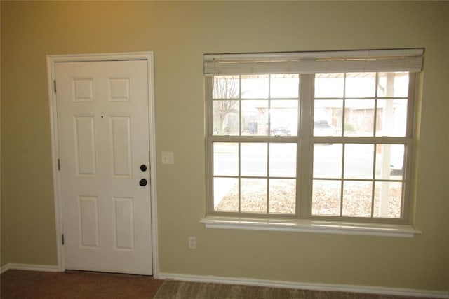 doorway featuring tile patterned flooring