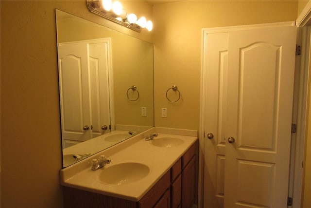 full bath featuring double vanity and a sink