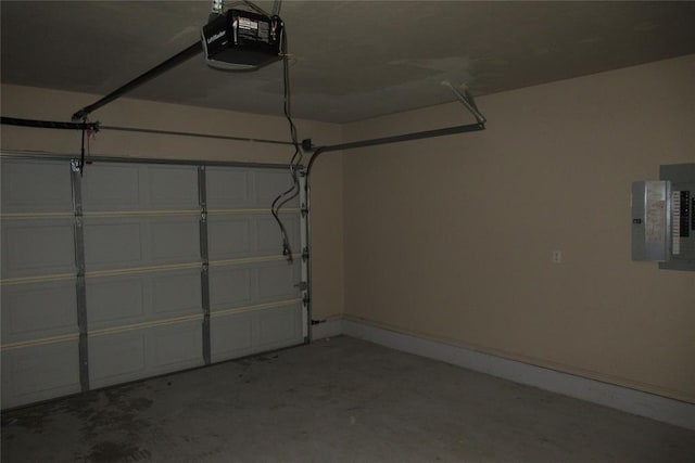 garage featuring electric panel and a garage door opener