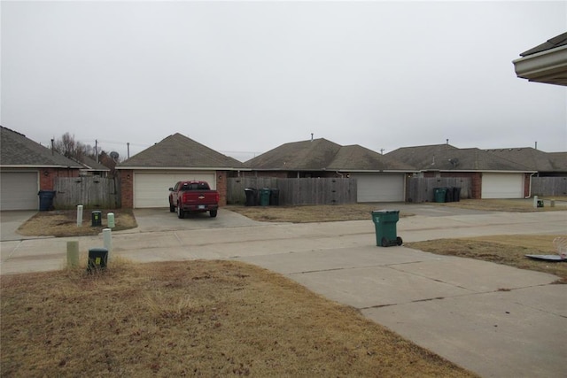 view of yard with a garage and fence