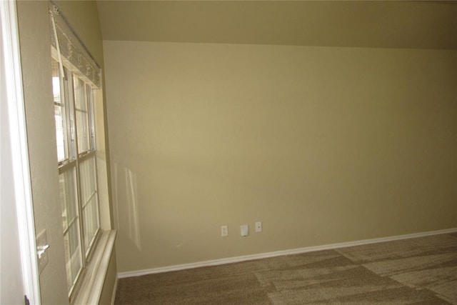 spare room with carpet flooring and baseboards