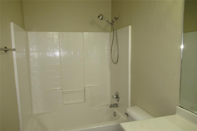 bathroom with vanity, toilet, and shower / tub combination