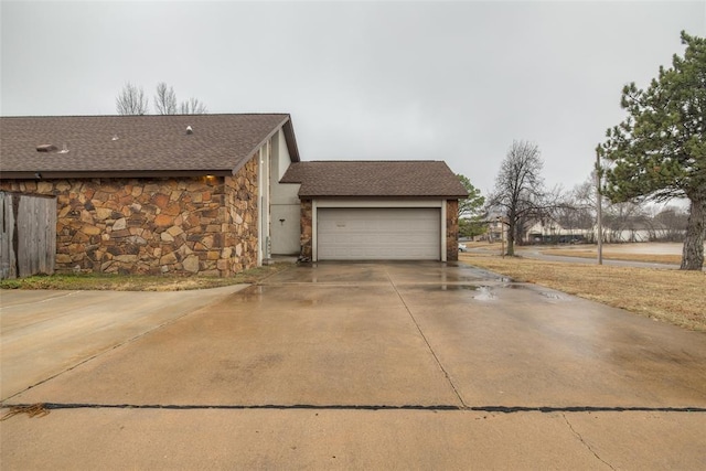 view of side of property with a garage