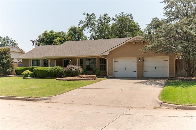 ranch-style house with a garage and a front yard