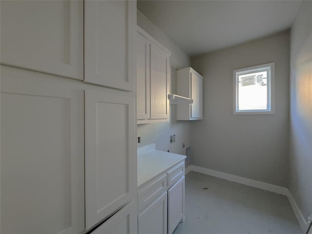 washroom featuring cabinets and washer hookup