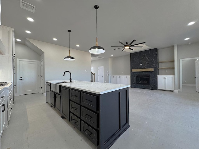 7225 NW 154th St, Edmond, OK 73013 - kitchen featuring white cabinets, recessed lighting, dark cabinets, visible vents, and a ceiling fan
