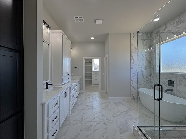 7225 NW 154th St, Edmond, OK 73013 - bathroom featuring marble finish floor, a freestanding bath, visible vents, vanity, and a marble finish shower