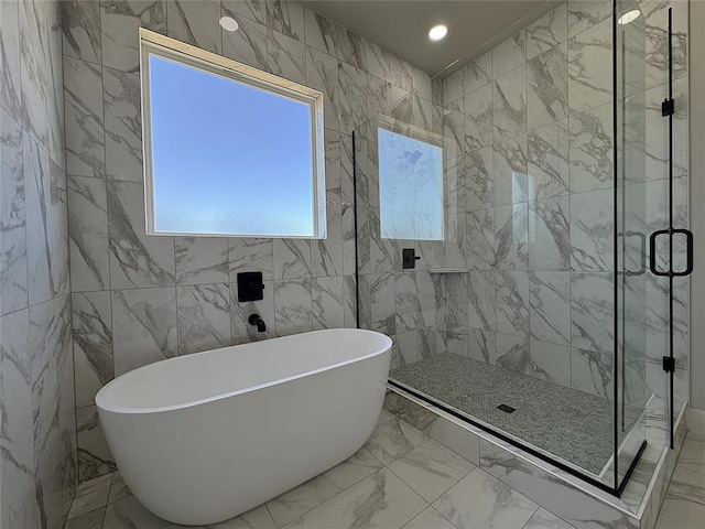 7225 NW 154th St, Edmond, OK 73013 - full bath featuring a shower stall, a freestanding tub, marble finish floor, and tile walls
