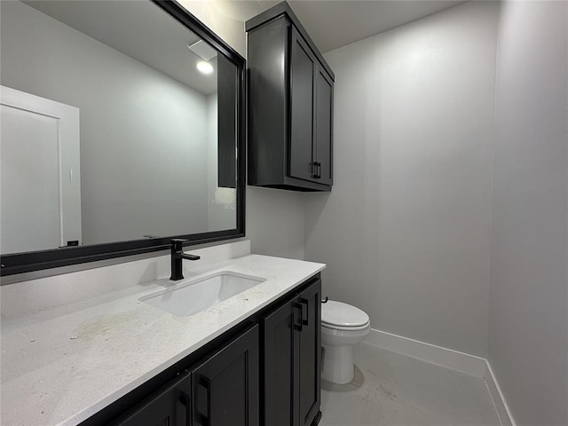 7225 NW 154th St, Edmond, OK 73013 - bathroom featuring toilet, vanity, and baseboards