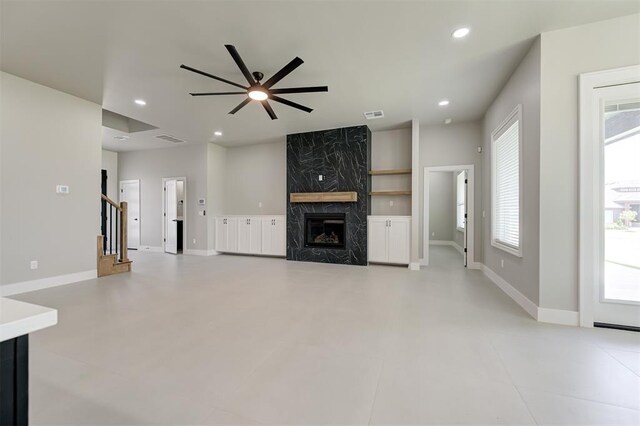 7225 NW 154th St, Edmond, OK 73013 - unfurnished living room with ceiling fan, a premium fireplace, stairs, and recessed lighting