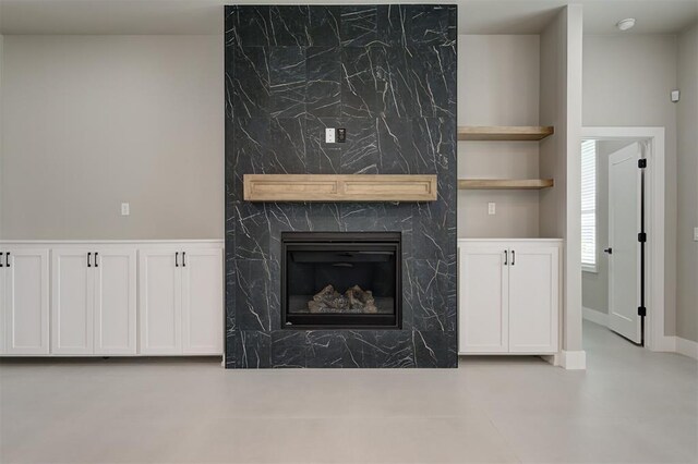 7225 NW 154th St, Edmond, OK 73013 - unfurnished living room featuring a premium fireplace