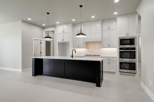 7225 NW 154th St, Edmond, OK 73013 - kitchen with built in microwave, double oven, decorative backsplash, cooktop, and white cabinetry