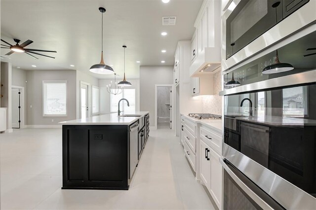 7225 NW 154th St, Edmond, OK 73013 - kitchen featuring dark cabinets, light countertops, recessed lighting, premium range hood, and stainless steel appliances