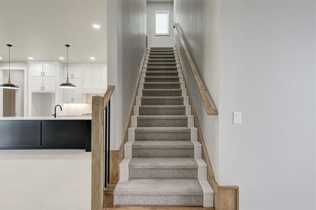 7225 NW 154th St, Edmond, OK 73013 - staircase featuring recessed lighting