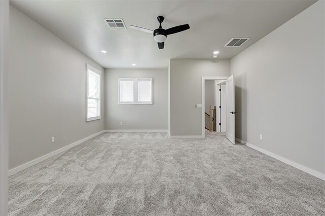 7225 NW 154th St, Edmond, OK 73013 - unfurnished bedroom featuring light carpet, a ceiling fan, and recessed lighting